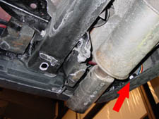 feed the harness down so that you can see it in the area near the muffler
